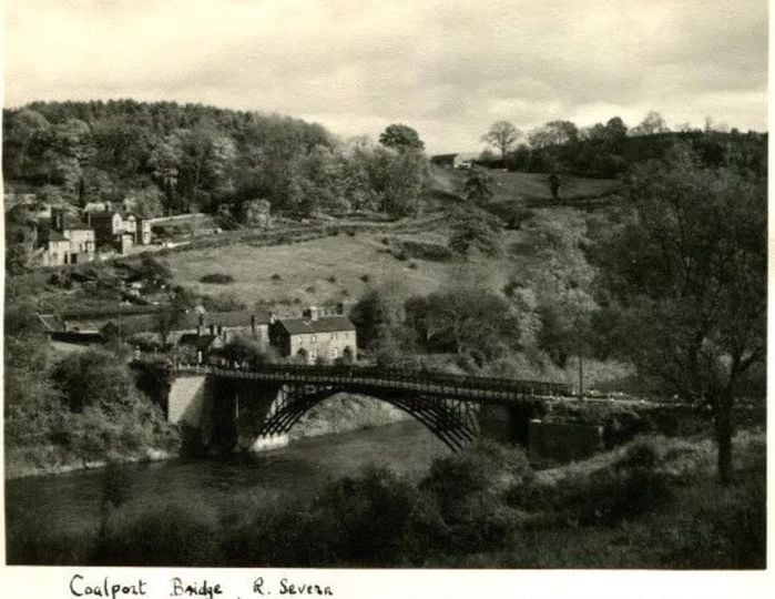 “Coalport Bridge, R. Severn” reads the caption on this early-1900s card, taken from downstream so the whole span sits low against the water. Notice just how little clearance there is between the iron arch and the river's surface — a design compromise that has made flooding the bridge's oldest and most persistent enemy.