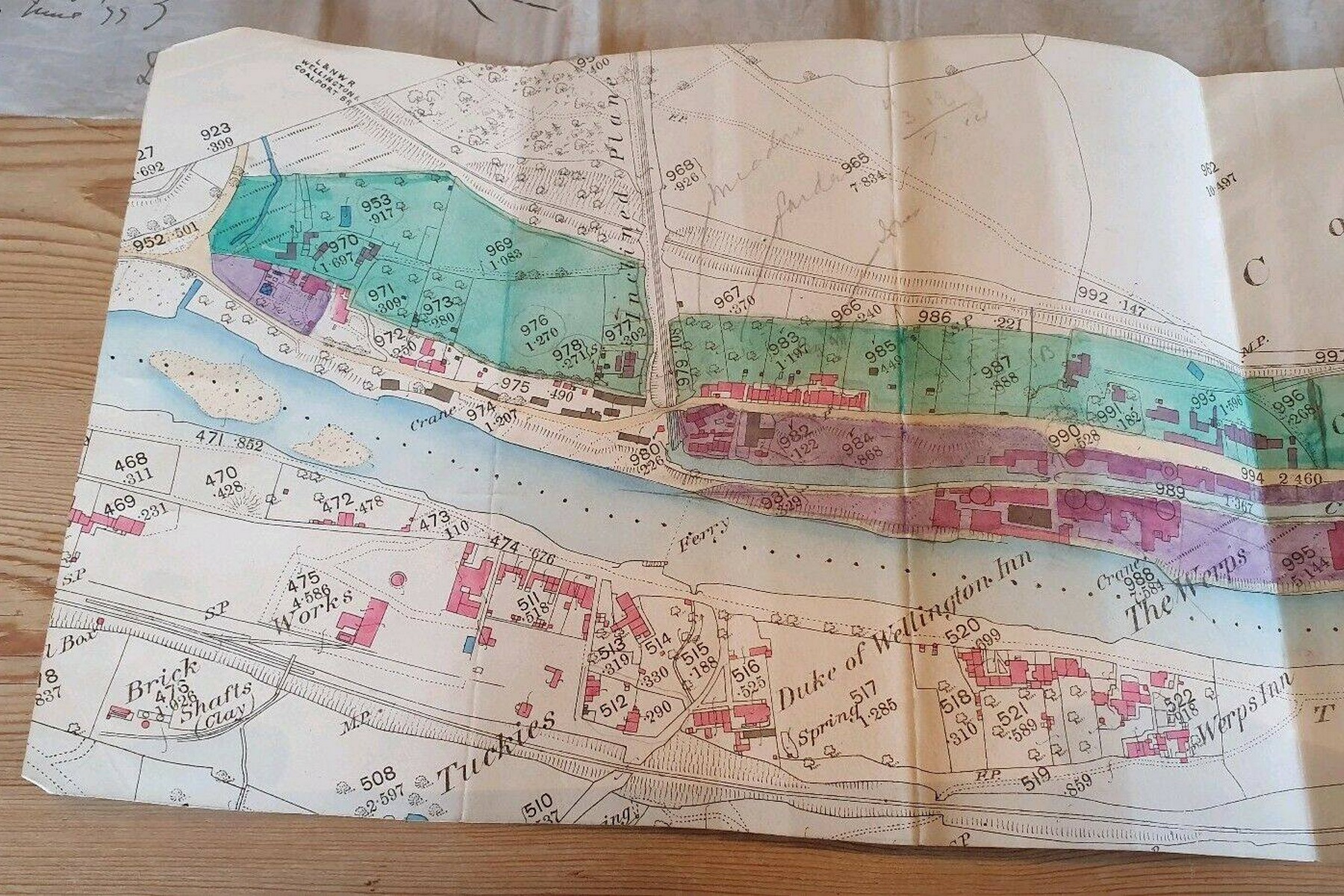 This hand-coloured plan of the Coalport area maps the canal and the plunging line of the incline down to the river — look closely and you can trace the china works, the Tar Tunnel and the wharves squeezed into the same tight stretch of valley. Surveyed in the late Victorian years, it shows just how crowded and industrious this small riverside settlement once was.