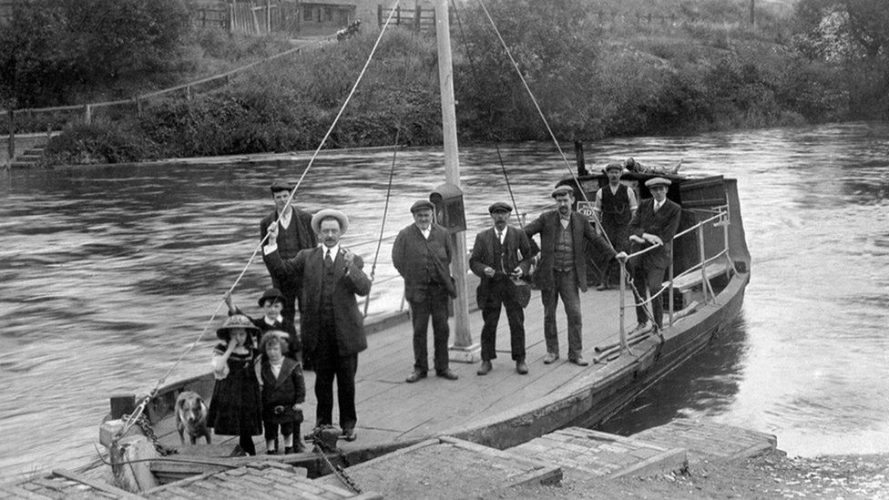 Men, children and a dog aboard the ferry