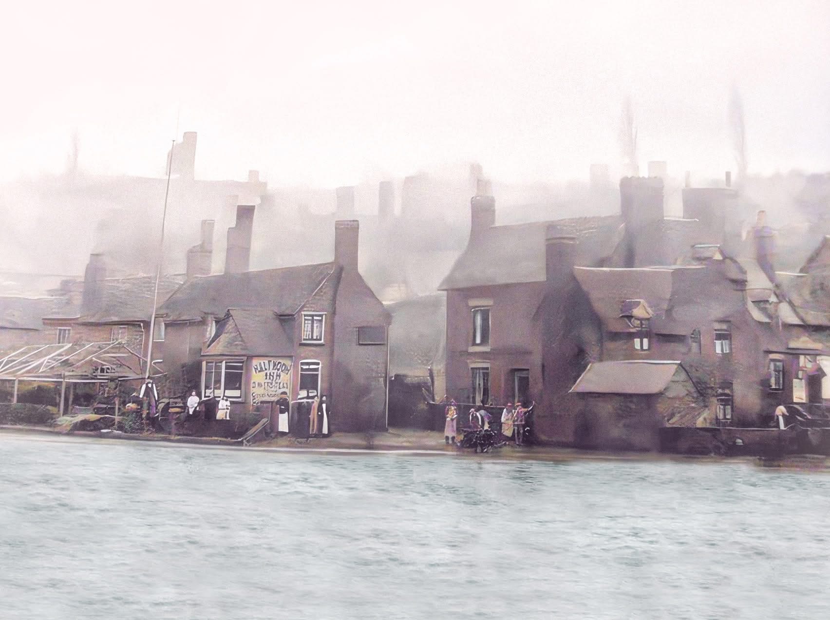 The Half Moon Inn at Jackfield, with drinkers outside and the riverside industries behind.
