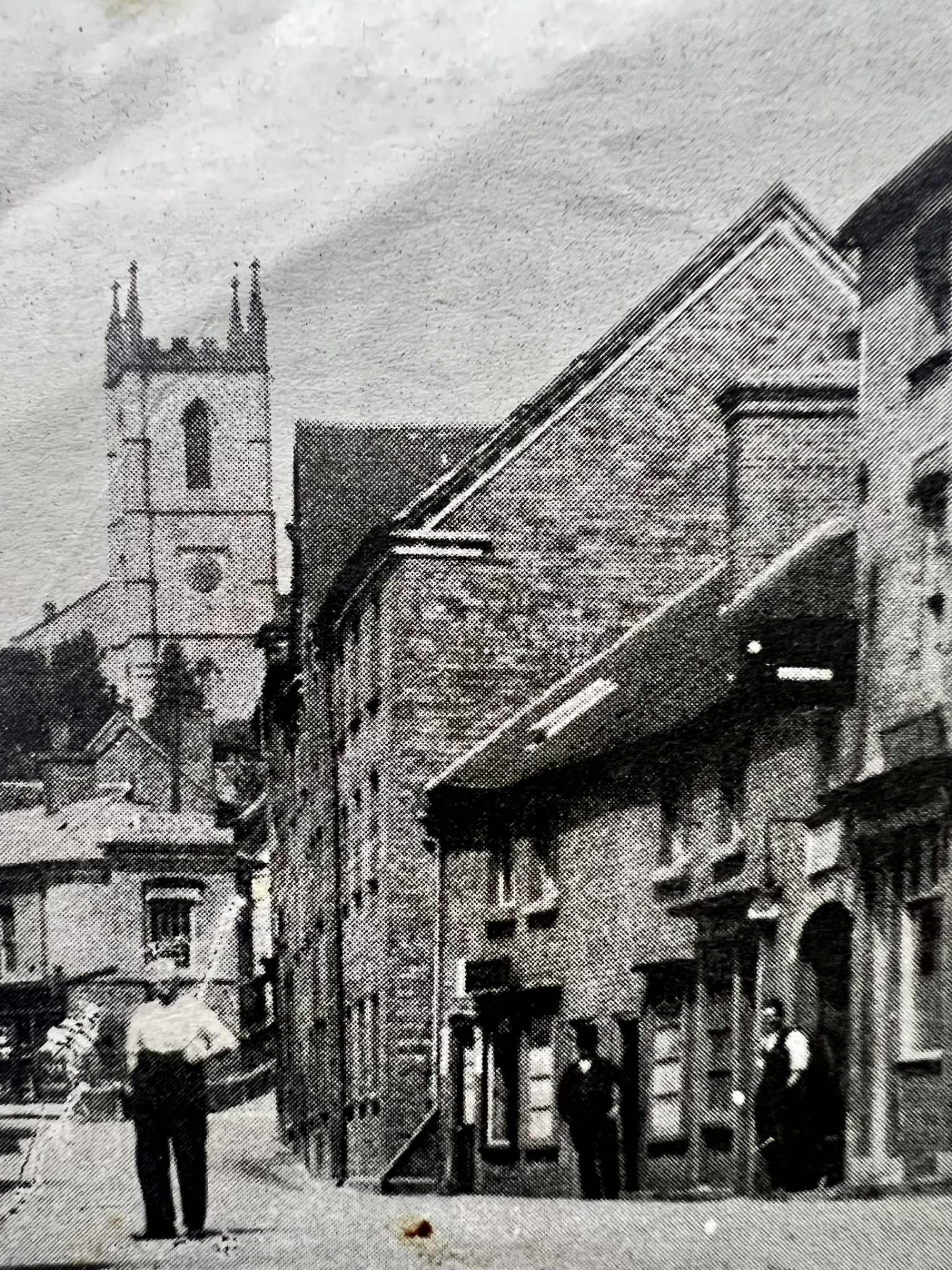 Looking down the street towards St Luke's Church, buildings tight to the pavement on both sides
