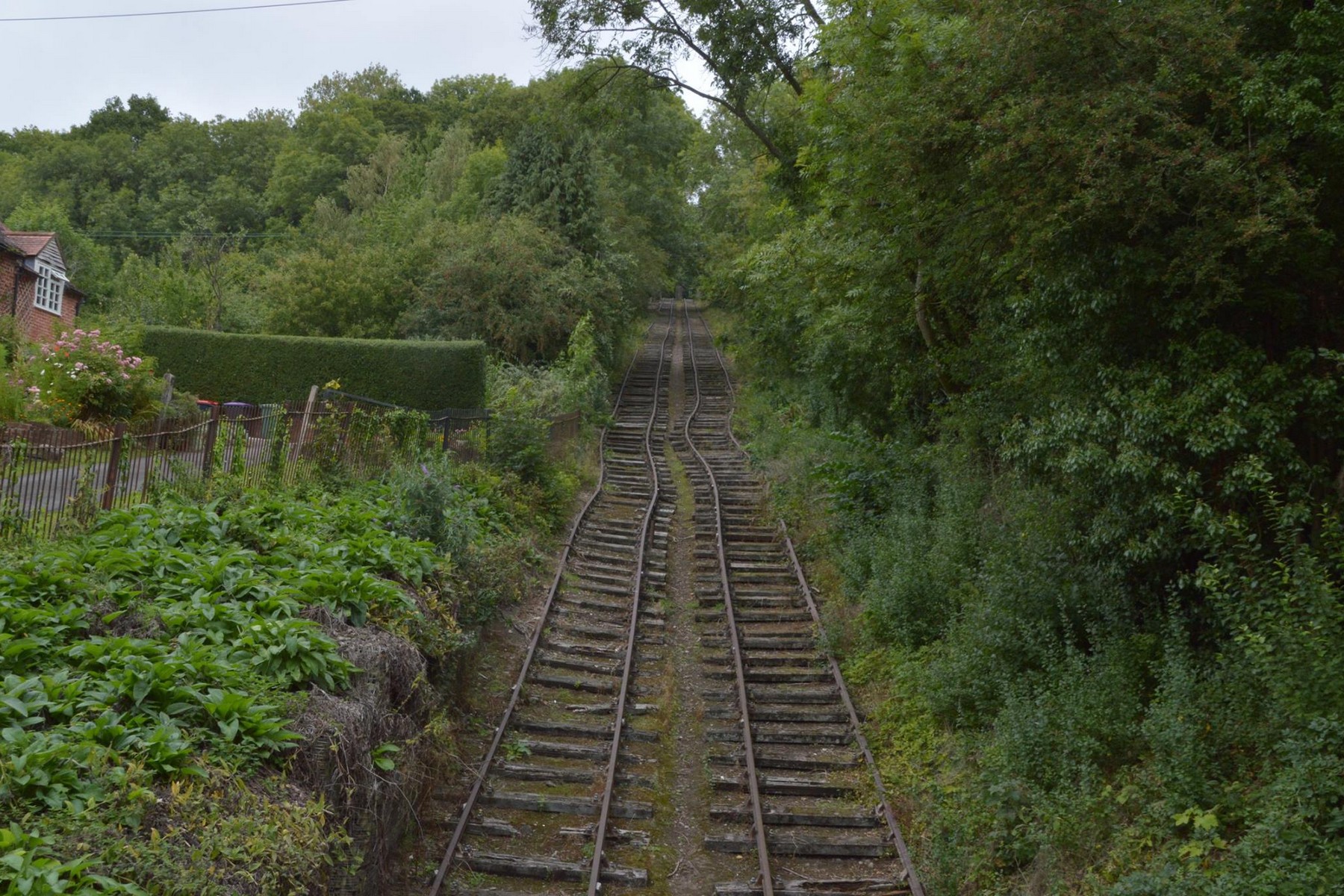 The full sweep of the incline today, flanked by trees with a brick house to one side, gives a real sense of scale: roughly 350 yards of track climbing at a gradient of about one in four. Few visitors expect the slope to feel quite this steep until they walk it themselves.