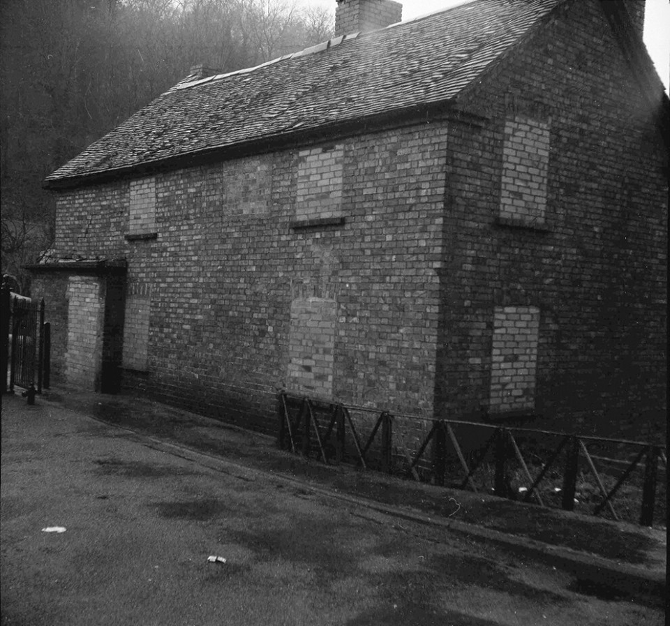 The Tollhouse before restoration, windows bricked up and the roof slipping.