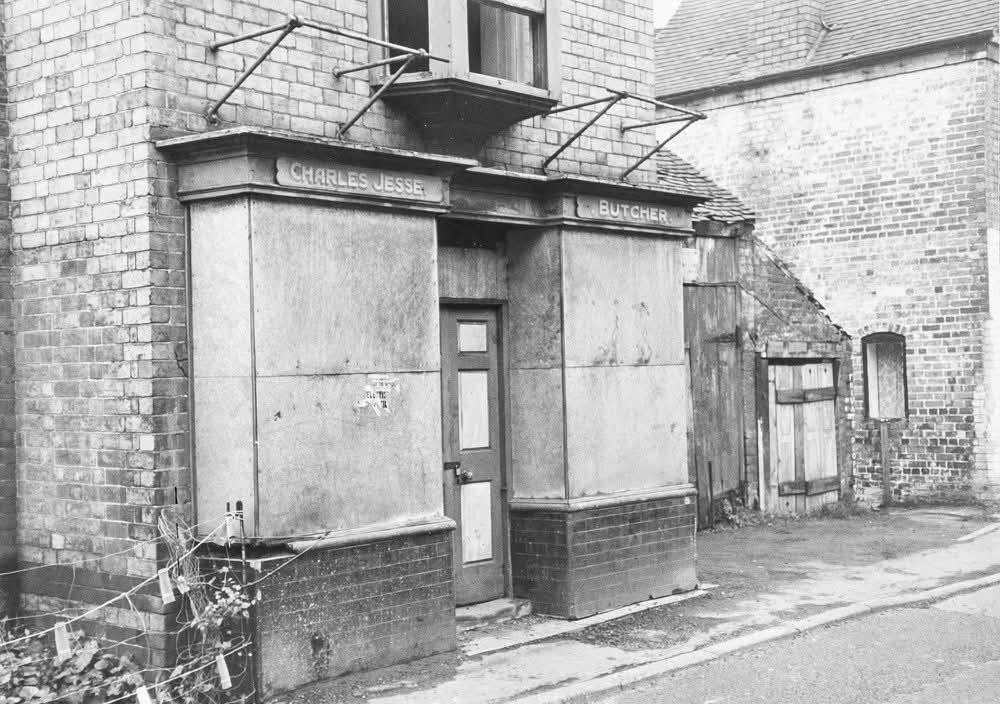 Charles Jesse, Butcher — the shopfront boarded up before clearance. The shop was saved and re-erected at Blists Hill Victorian Town, where it stands today