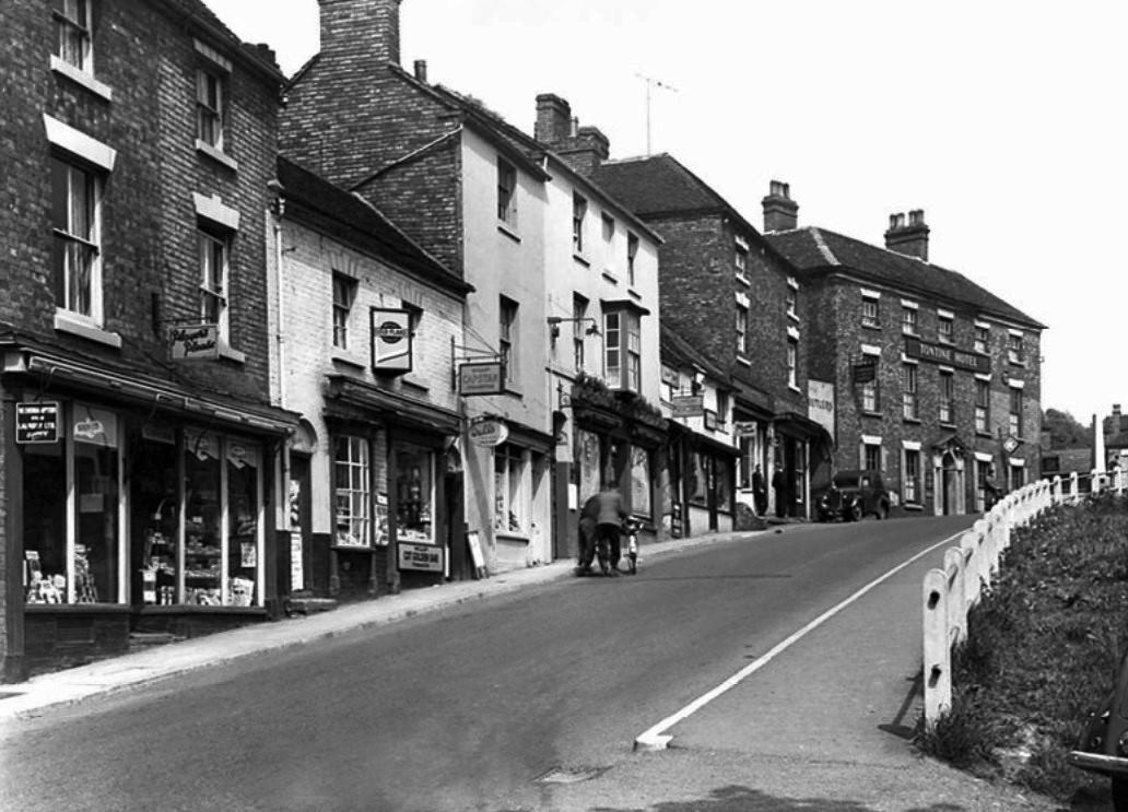 Looking up the hill past the shops towards the Tontine Hotel