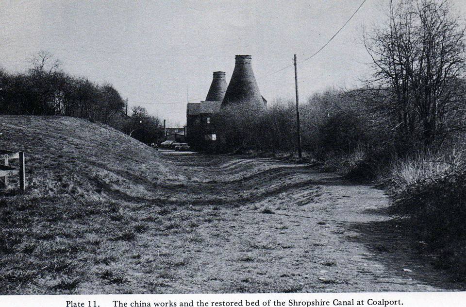 The dry canal bed with the Coalport China Works bottle kilns beyond