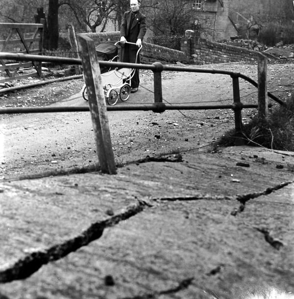 The riverside road cracking and being pushed towards the Severn.