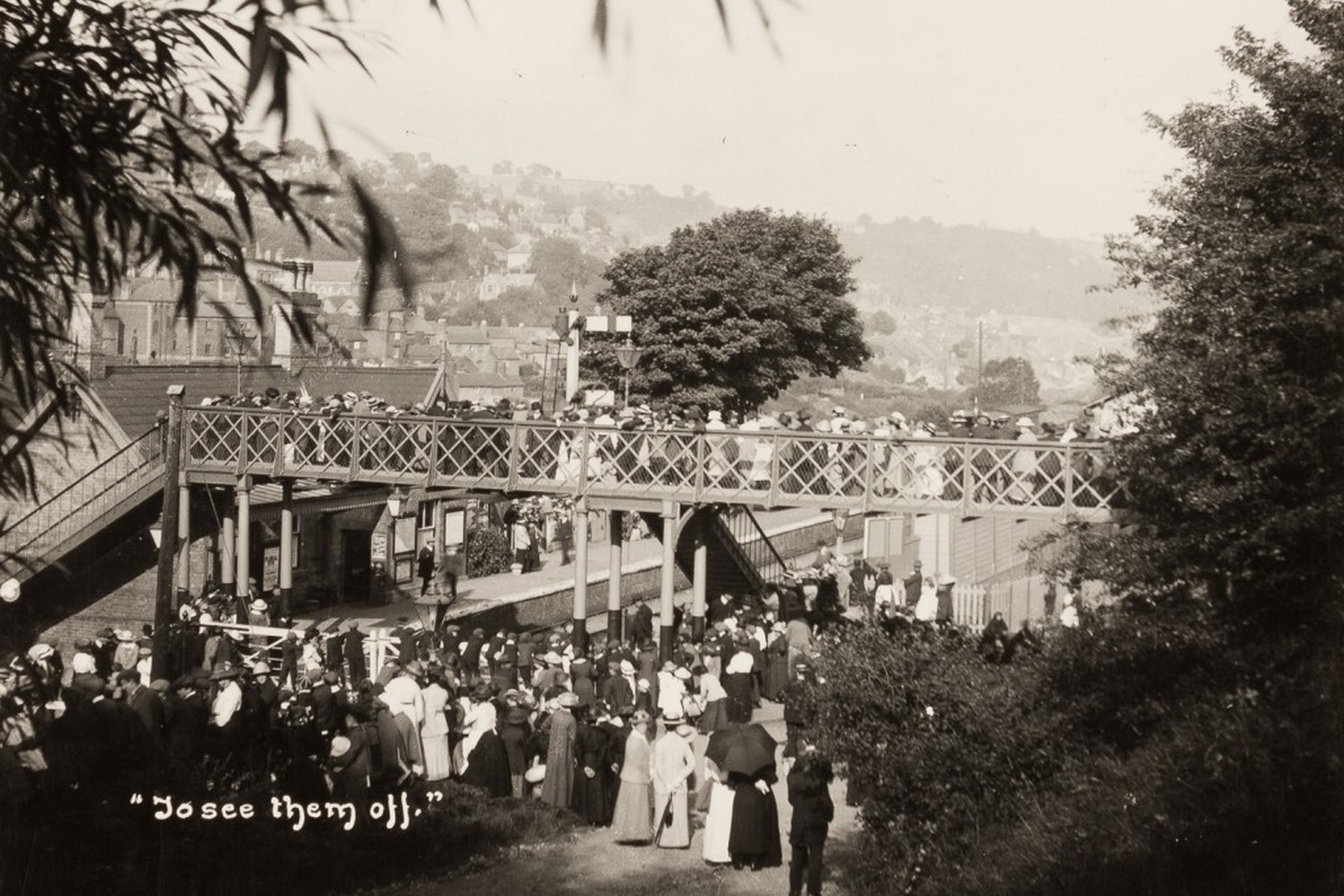 Captioned at the time simply “To see them off,” this photograph shows the platform and footbridge packed with the people of Ironbridge seeing their men off to war. Whole families turned out for a departure like this — some of the men they waved away would never return, and some would come home broken. It is not a scene of ordinary station life, and it was never meant to be remembered as one.