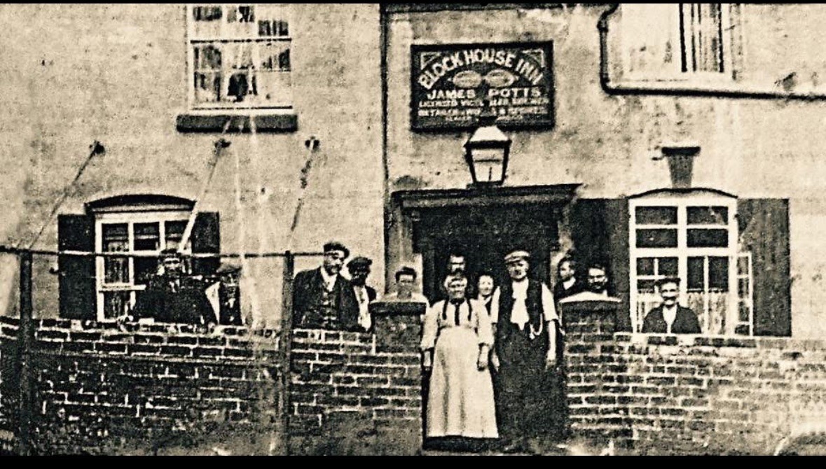 The Block House Inn — the painted signboard appears to name James Potts — with a group gathered outside