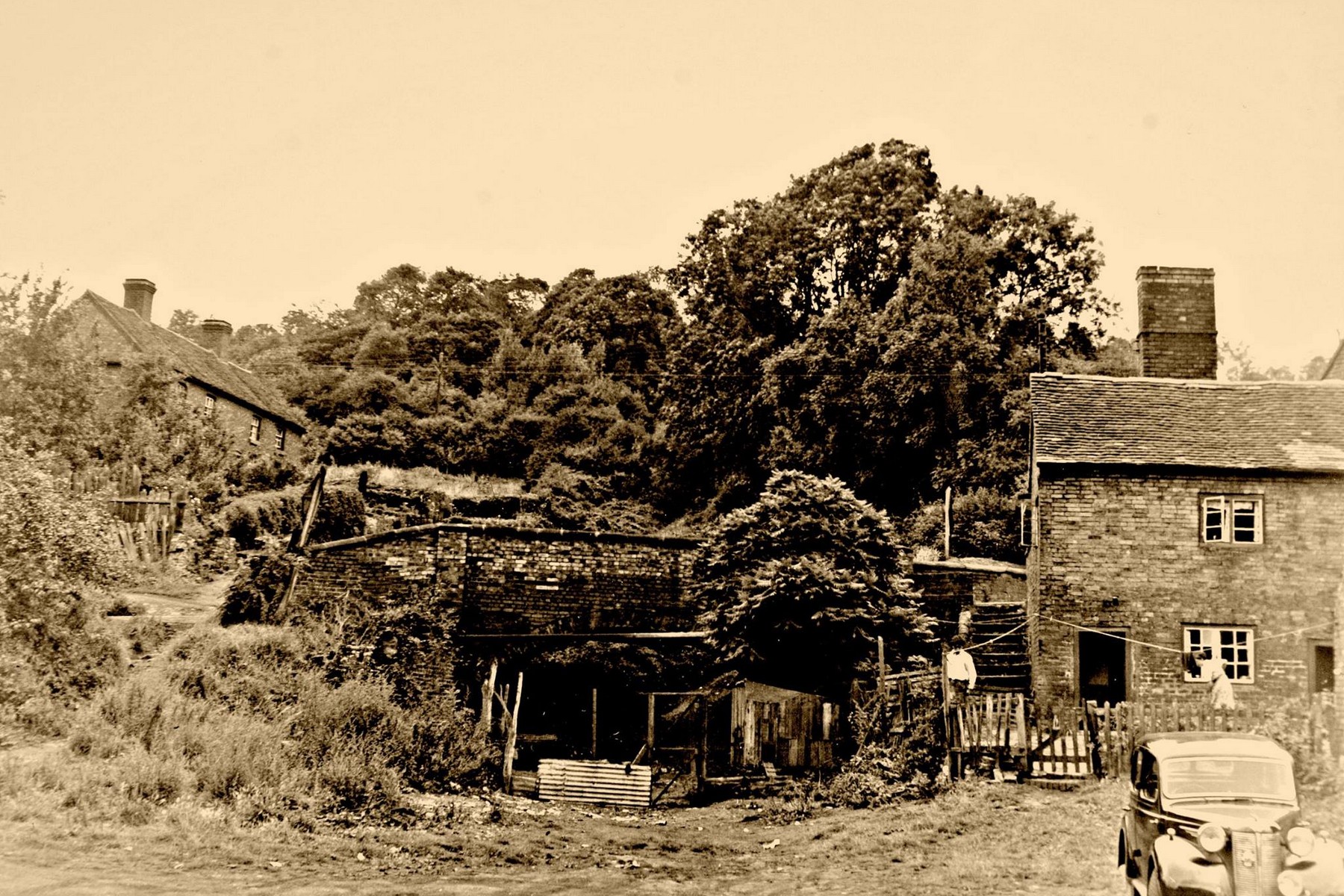 These ivy-clad buildings beside the incline at Coalport once served the works clustered at the foot of the slope, in the early years of the twentieth century. The winding house proper stood higher up, at the summit near SJ 695028, and its ruined walls and tall brick chimney were still standing as late as 1974 — a slow, visible decay rather than a sudden loss.