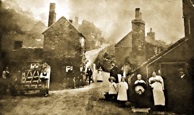 Villagers gather outside the toll house in this early-1900s photograph, a barrel being rolled towards the gate as everyday business goes on. The image later found new life when the Shropshire Star reprinted it decades on, asking readers to help identify the building — proof of how quickly local memory can fade.