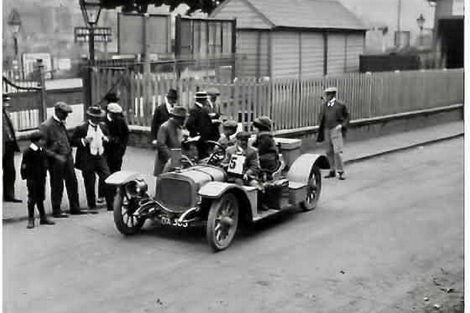 Competition car number 5 with officials and spectators at an Ironbridge hill climb