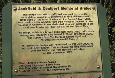 The interpretation plaque at the bridge, recording the 1922 public subscription, the bowed Pratt steel truss design, and the 2000 refurbishment by Telford & Wrekin Council with the Heritage Lottery Fund and the Onyx Environmental Trust.