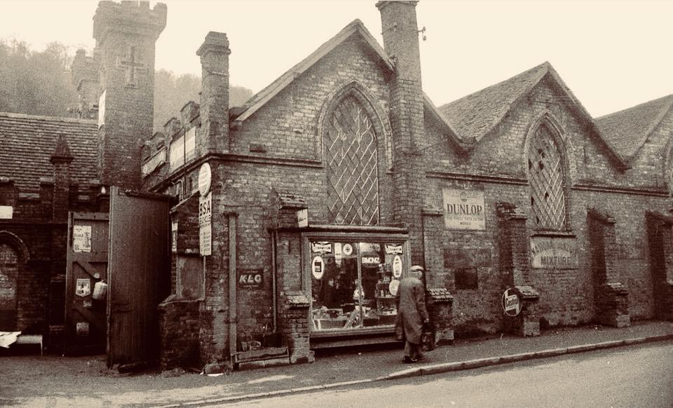 Dunlop and BSA signs on the Wharfage frontage: cycle and motor trade in the old warehouse