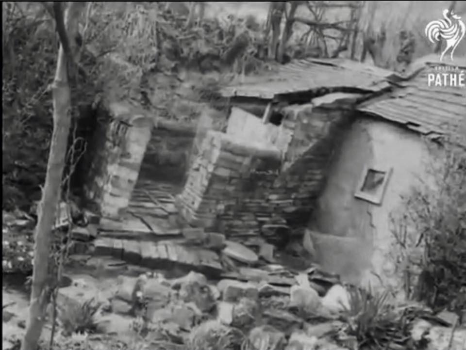 The remains of one of the cottages damaged during the landslip. Still from British Pathé newsreel, 1952.